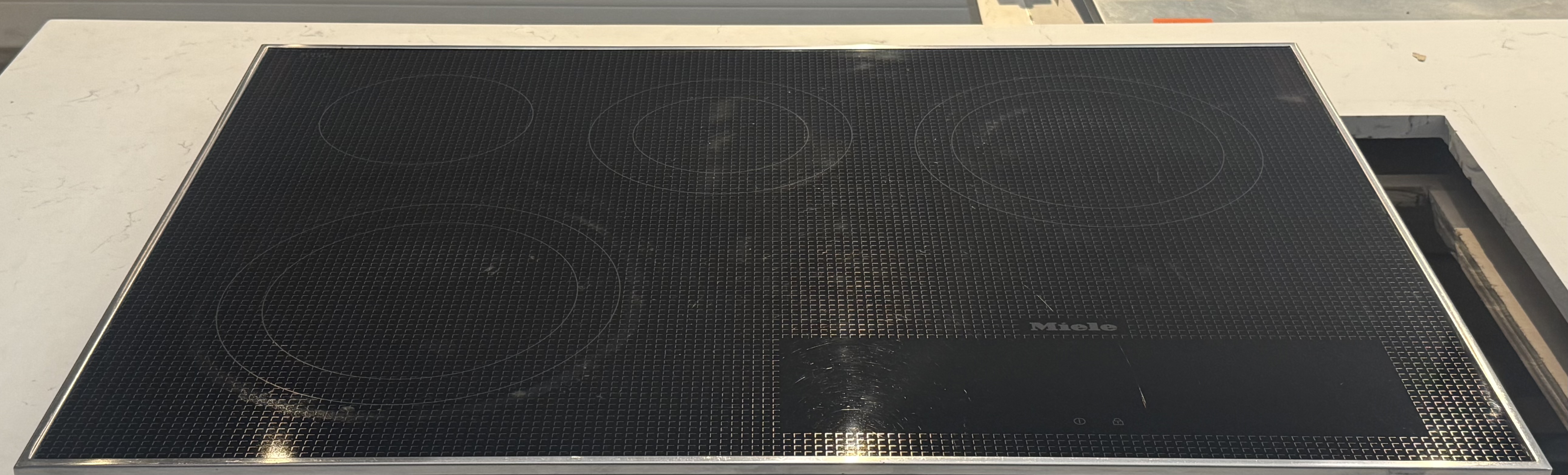 MIELE 30" Electric Cooktop With 4 Cooking Zones Black With Stainless Steel Frame KM5840208V